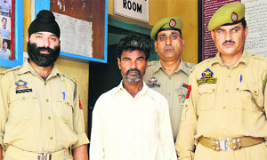 Ram Preet Paswan, who killed his daughter, in the custody of the Jammu railway police. 