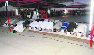Muslims offer namaz before an ifftar party during the holy month of Ramadan.