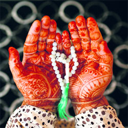 A woman prays during Ramadan in Srinagar on Tuesday.