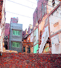 Old dilapidated buildings were demolished by Municipal Corporation teams at Chowk Passian recently in Amritsar