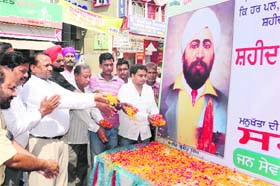 Paying tributes: Members of Sahara Jan Sewa pay floral tributes to Shaheed Udham Singh on his martyrdom day in Bathinda on Wednesday