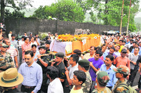The body of Rifleman Manoj Rana, who was killed in action in Jammu and Kashmir, being taken in a coffin for cremation in Dehradun on Wednesday.