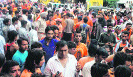 Kanwariyas hold a protest on the National Highway-73 near Kalanour on Wednesday. 