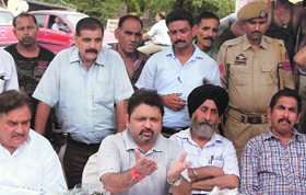 Officials of the Jammu Municipal Corporation address mediapersons during an awareness camp in Jammu on Wednesday