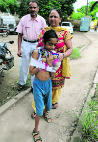A special child Guneek Goyal on his way to the camp held under the Inclusive Education for the Disabled programme of the Sarva Siksha Abhiyaan, at Government Elementary School in Bathinda on Thursday.