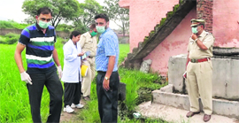 A team of the police and forensic experts at the crime scene in Charnia village near Pinjore on Thursday.