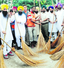 Deputy Commissioner Tejinder Pal Singh Sidhu and councillors at the launch of the sanitation campaign at YPS Chowk in Mohali on Thursday.