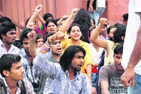 Students of the State Institute of Film and Television protest outside their campus against a hike in fees in Rohtak on Thursday