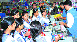 Commerce students of Class XII of Sugni Devi Arya Girls Senior Secondary School, Ladwa, try to understand billing through bar-coding at a mall. Photo: DR Vij