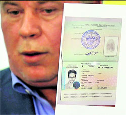 Russian lawyer Anatoly Kucherena shows a temporary document to allow Edward Snowden to cross the border into Russia at Sheremetyevo airport outside Moscow on Thursday.