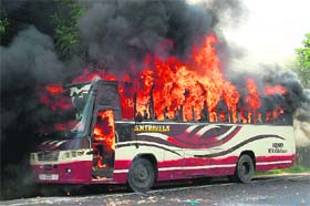 A bus, allegedly set on fire by demonstrating Jamaat-e-Islami activists, burns in Bogra town on Thursday