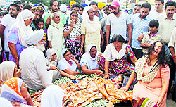 The inconsolable family members of Simranjit Kaur in Amritsar on Friday