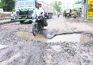 Water accumulated on a damaged road near DAV College in Bathinda on Friday.