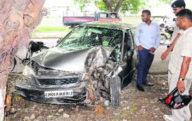 CLOSE SHAVE: The occupants of a car had a providential escape after it rammed into a tree on the road dividing Sectors 15 and 16 in Chandigarh on Friday