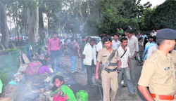 A footpath being encroached upon by slum people. A file photograph