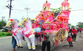Kanwariyas carry an attractive Kanwar chariot in Haridwar on Friday
