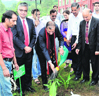 Nagaland Governor Ashwani Kumar waters a sapling at the Central University of Himachal Pradesh in Shahpur on Friday. Photo: Ashok Raina