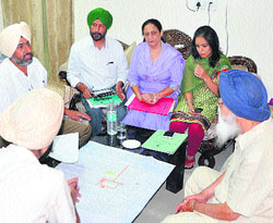 Chief Minister Parkash Singh Badal discusses with experts the setting up of an education hub in Jalandhar on Friday. 