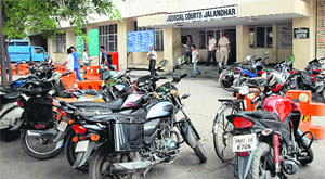 Vehicles parked haphazardly at Judicial Court Complex in Jalandhar. 