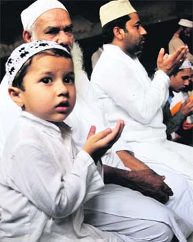 For a better tomorrow: A child prays along with his family during Jumat-ul-Wida at Jama Masjid at Talabd Khatinkan in Jammu on Friday
