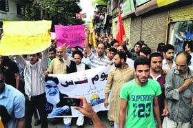 Youth protest against Israel after the Jumat-ul-Vida prayers on the last Friday of Ramadan in Srinagar