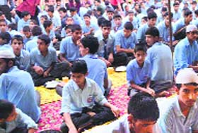 Children at the Iftaar party organised by the University of Kashmir in Srinagar on Thursday