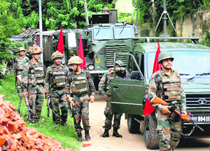Security personnel patrol in Diphu town on Friday following violent protests demanding a separate state of Karbi Anglong.
