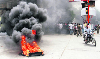 People protest against the creation of Telangana state, in Tirupathi on Friday.
