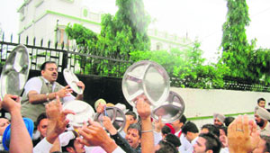 BJP and Yuva Morcha activists protest outside Partap Bajwa's residence at Qadian in Gurdaspur on Friday. 