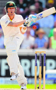 Michael Clarke hits a four during the third Ashes cricket Test match against England at the Old Trafford ground in Manchester. 