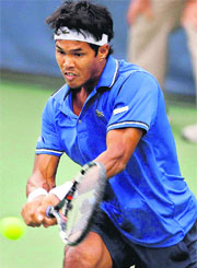  Somdev Devvarman hits a backhand during his third round match against John Isner at the Citi Open tournament in Washington on Thursday. 