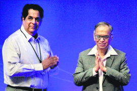 Infosys founding member, Narayana Murthy (R), and director KV Kamath during an Extraordinary General Meeting where Murthys appointment was ratified by shareholders in Bangalore on Saturday. 
