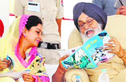 Chief Minister Parkash Singh Badal and Bathinda MP Harsimrat Kaur Badal share a point during the oath-taking ceremony of newly elected sarpanches and panches.
