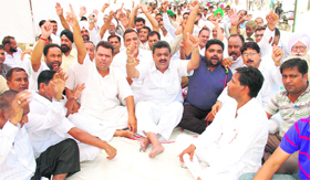 Congress workers stage a protest in Bathinda on Saturday against the SAD-BJP government in Punjab.