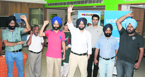 Owners stage a protest at the office of Unitech Builders, Sector 17, Chandigarh, on Saturday.