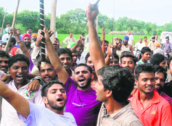 Residents of Kathunangal protest against the police near Amritsar on Saturday. A Tribune photograph