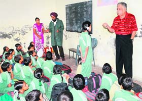 Brij Bedi and Master Ajit Singh at their school in Maqboolpura, Amritsar