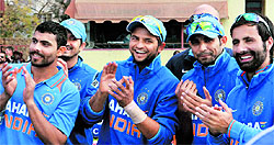 India players look pleased as their captain receives the trophy after beating Zimbabwe 5-0 in what turned out to be a pretty one-sided series