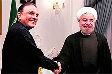 Irans new President Hassan Rowhani (R) welcomes Pakistans President Asif Ali Zardari on his first day in office in Tehran