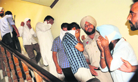 Police takes away youths who were found to be present at the brothel during the raid.
