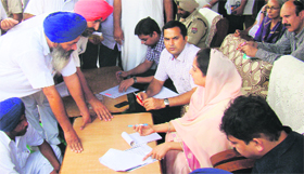 Member of Parliament from Bathinda, Harsimrat Kaur Badal, meets people during a sangat darshan programme on Sunday.