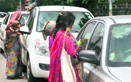 Beggars hinder the smooth flow of traffic at an intersection in Dehradun on Sunday.