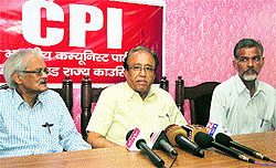 S. Sudhakar Reddy, general secretary of the CPI addresses mediapersons in Dehradun on Sunday; and (below) CPI officials and workers observe a two-minute silence in Mussoorie