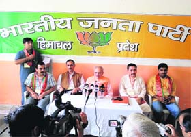 BJP leader Balbir Punj addresses a press conference at Palampur on Sunday