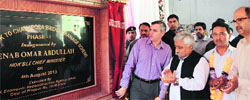 Chief Minister Omar Abdullah inaugurates a drainage scheme at Chanapora in Srinagar on Sunday. 
