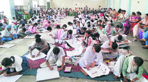 Students of government schools participate in a poster-making contest in Jalandhar on Sunday. 