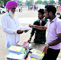 A panch purchases a book on panchayat laws in Ludhiana on Sunday
