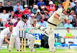 Usman Khawaja flicks one through midwicket as England wicketkeeper Matt Prior looks on, at Old Trafford, Manchester, on Sunday