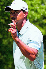Tiger Woods reacts during the Round 3 of the World Golf Championships-Bridgestone Invitational at Firestone Country Club South Course on Sunday