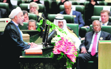 Irans President Hassan Rouhani (L) delivers a speech after his swearing-in ceremony in Tehran on Sunday. 